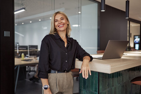 Confident and Professional Individual in a Contemporary Office Environment Settingの写真素材