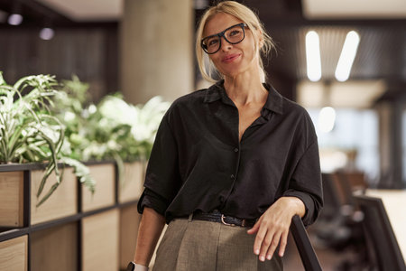 A Confident and Empowered Professional Who Is Thriving in a Modern Dynamic Workspace Todayの写真素材