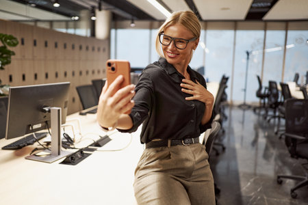 Modern Office Selfie Capturing Authentic and Professional Moments in the Workplace Environmentの写真素材