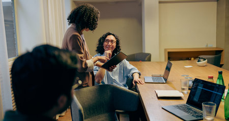 Mentor Advises Colleagues, Elder Colleague Provides Mentorship During Casual Office Discussion