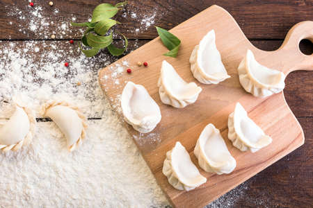 dumplings on a wooden board, cooking, Russian traditional cuisineの写真素材