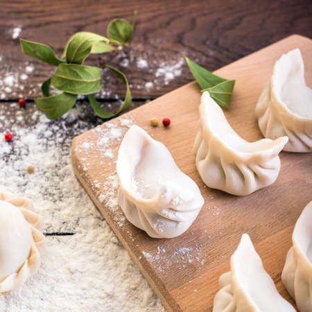 dumplings on a wooden board, cooking, Russian traditional cuisineの写真素材