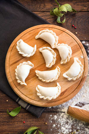 dumplings on a wooden board, cooking, Russian traditional cuisineの写真素材