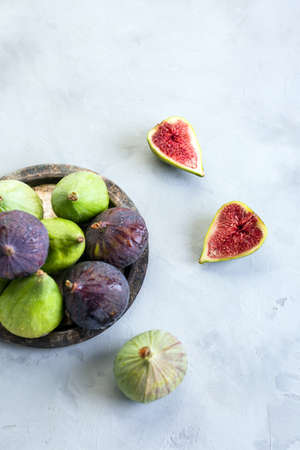 Figs, green and blue, gray stone backgroundの写真素材