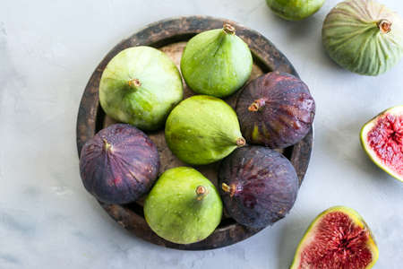 Figs, green and blue, gray stone background