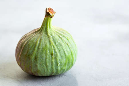 Figs, green and blue, gray stone backgroundの写真素材