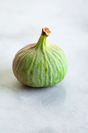 Figs, green and blue, gray stone backgroundの写真素材