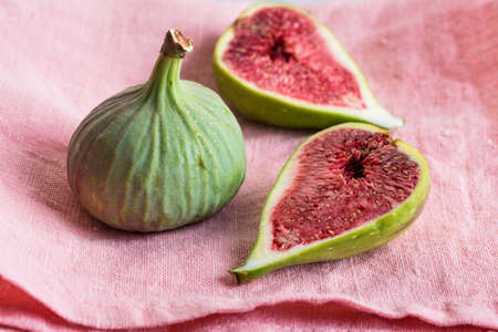 Figs, green and blue, gray stone backgroundの写真素材
