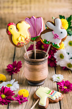 Easter cookies birds and rabbit on a wooden table with copy space. Spring Baking Theme