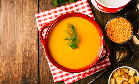 Lentil mashed soup in a pan, wooden backgroundの写真素材