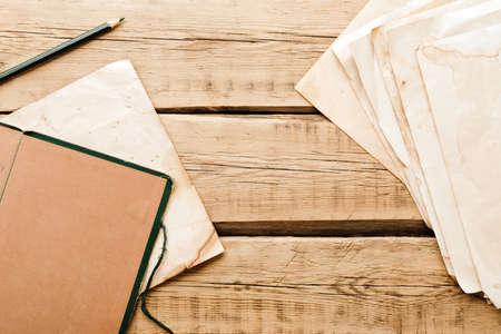 Vintage paper. Old notepad on a wooden background. Copy spaceの写真素材