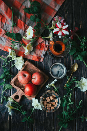 Dark photo of food. beautiful flat layout in rustic style with flowers and coffee.
