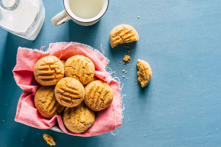 cookies in a bowl on a blue background. homemade baking. copy space. High quality photo