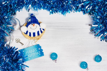 Christmas decoration with different decorative elements in blue colors on rusty white backgroundの写真素材