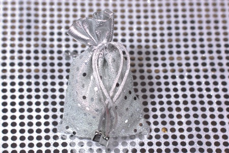 Christmas silver packing on shiny backgroundの写真素材