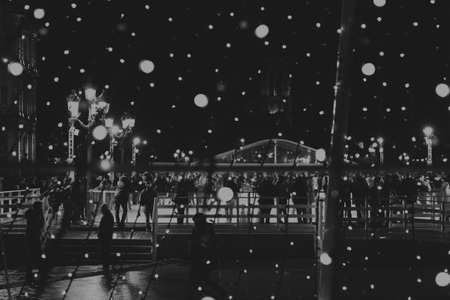 Christmas artwork with people and lights (black and white)のeditorial素材
