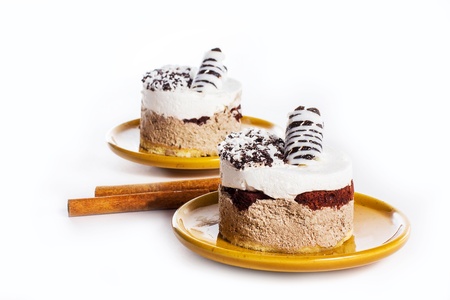 Luxury dessert on the round plate, isolated on whiteの写真素材