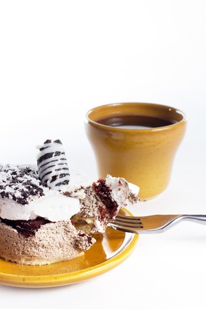 Tasty dessert on the round plate with cup of coffe, isolated on whiteの写真素材