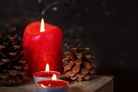 Christmas decoration with candles and old bookの写真素材