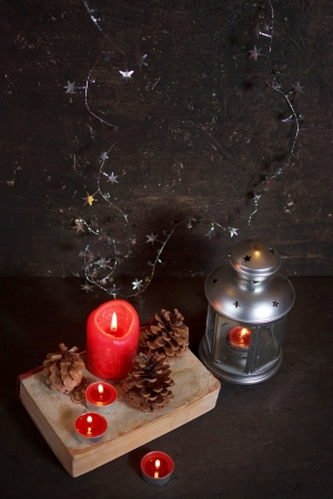 Christmas decoration with candles and old bookの写真素材