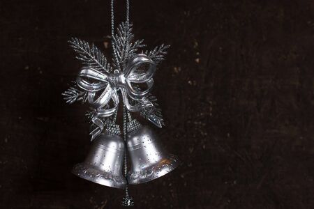Christmas decoration with silver bells with wooden backgroundの写真素材