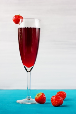 Strawberry wine or juice with berries, in high wineglassの写真素材