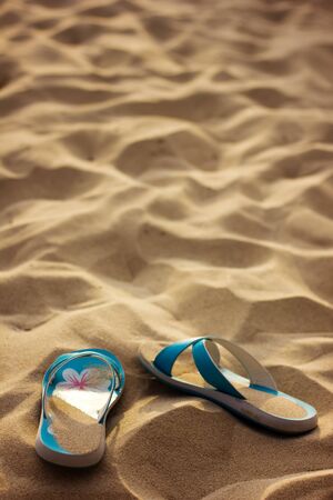 Slippers in sand, without peopleの写真素材