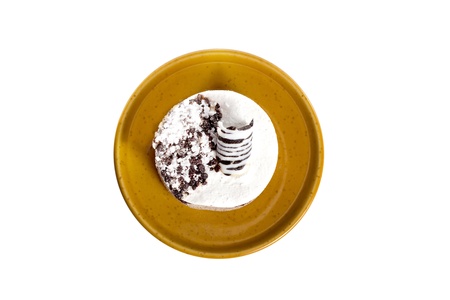 Luxury dessert on the round plate, isolated on whiteの写真素材