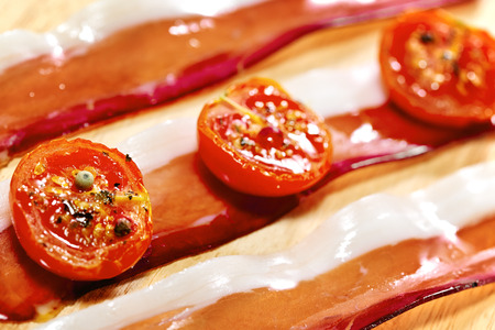 Dried cherry tomatoes with bacon. の写真素材