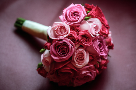Wedding flowers. Pink and red roses. Gentle lovely bouquet. Selective focus. Shallow depth of field.の写真素材