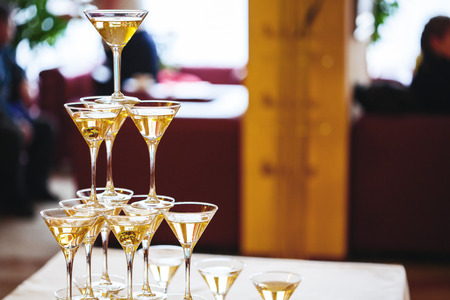 Celebration. Pyramid of champagne glasses. Gently toned.の写真素材