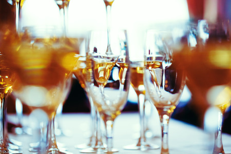 Celebration. Abstract picture of champagne glasses. Gently toned, vintage colors, selective focus.の写真素材