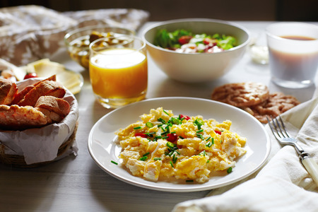 Fresh breakfast food  Scrambled eggs, bread, coffee and orange juice  Cocept of nutritious healthy food or continental breakfast の写真素材