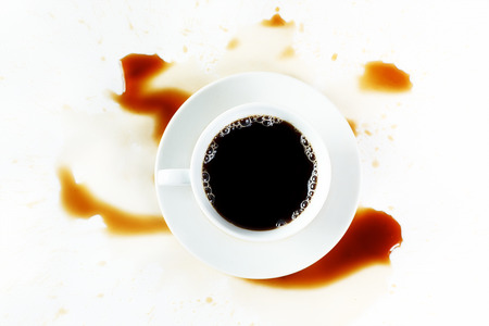 Cup of black coffee on white background with creative stains  Breakfast concept  の写真素材