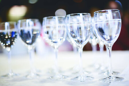 Row of water glasses  Pure drinking water  Selective focus, abstract background, concept of cateringの写真素材