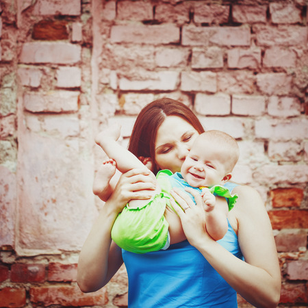 Beautiful young mother playing with baby. Happy family. の写真素材