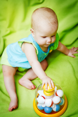 Adorable little baby playing with educational toys. One or two years old.の写真素材