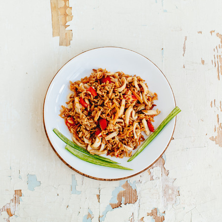 Fried rice with seafood. Asian cuisine. Thai spicy food. Square composition, top view.の写真素材