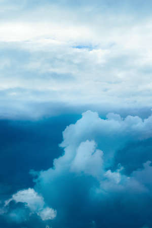 Dramatic stormy sky with clouds. Deep blue color.の写真素材