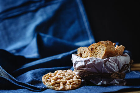 Bread or french baguette on blue background. Rustic kitchen.の写真素材
