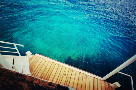 Deep sea and wooden pier  の写真素材