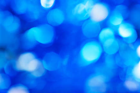 Blue defocused background with bokeh lightsの写真素材