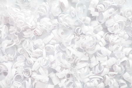 White paper streamer decoration with baubles, fir branch, and cones. Holiday greeting card concept.の写真素材