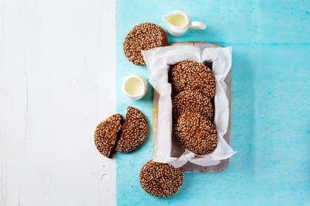 Fresh Chocolate Crispy Cookies with Sesame in Package Served with Milk on Table for Breakfast. Top view. Space for Your Text.の写真素材