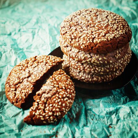 Healthy Fresh Baked Cookies with Sesame on BlueBakery Paper. Close up.の写真素材
