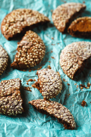 Healthy Fresh Baked Cookies with Sesame cracked on Blue Paper Background. Close up.の写真素材