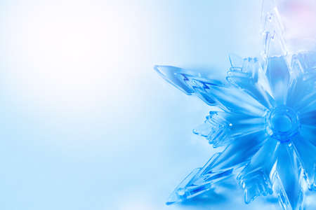 Simple Light Blue Christmas Background with Crystal Snowflake. Space for Text.の写真素材