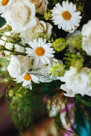 Close Up of Fresh Bouquet of White Roses and Chamomile. Selective Focus, Shallow Depth of Field, Space for Text.の写真素材