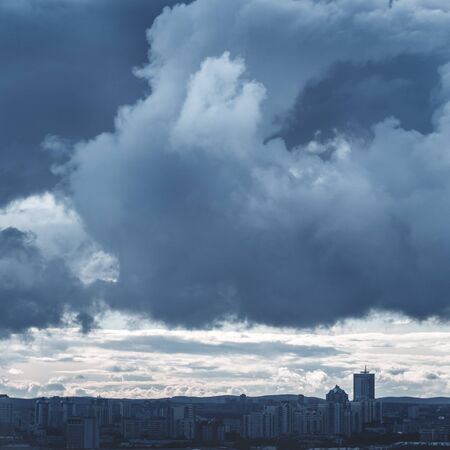 Monochrome Landscape with Stormy Sky and Industrial City. Image Toned with Blue Colors. Moody Background.の写真素材
