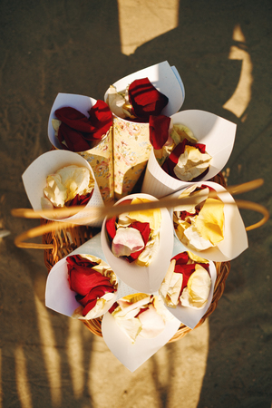 Wedding Reception on a Beach. Basket with Rose Flower Petals Ready for Ceremony.の写真素材